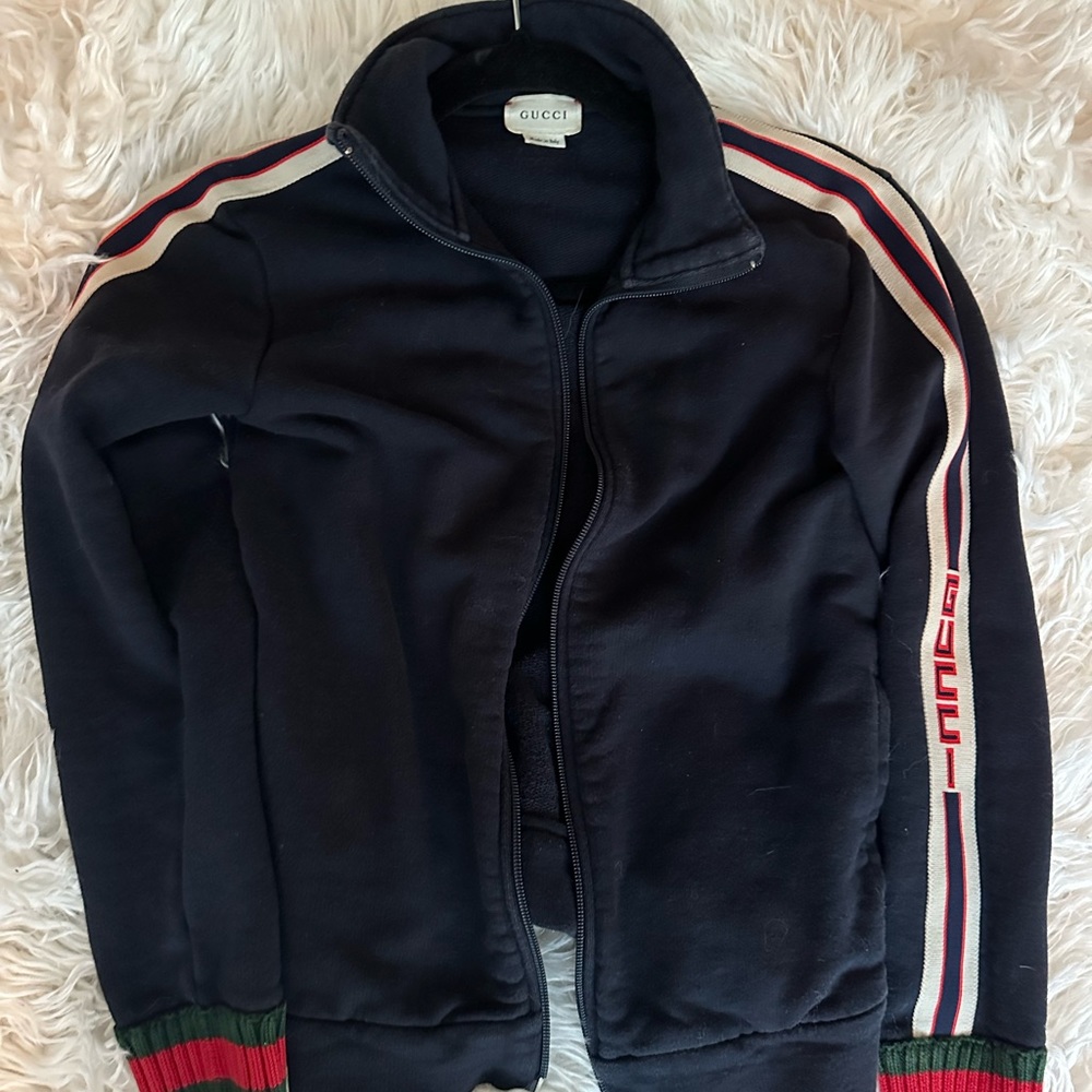 Gucci clothing from store Xs-s can fit